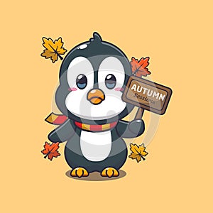 Cute penguin with autumn sign board.