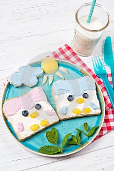 Cute penguin toasts with spread on a plate, food for kids ideas
