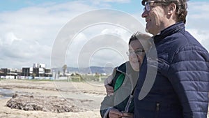 Cute pensioners on a walk along the sea