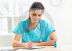 Cute physician woman working in her office