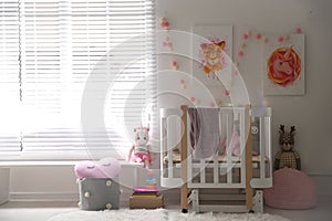 Cute pictures and crib in baby room interior