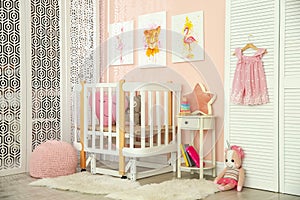 Cute pictures and crib in baby room interior