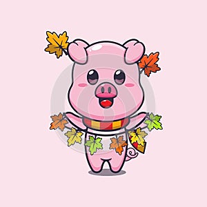 Cute pig with autumn leaf decoration.