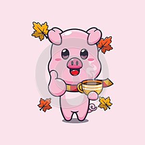 Cute pig with coffee in autumn season.