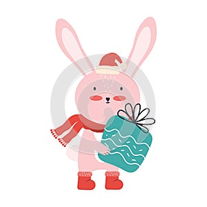 Cute pink baby rabbit in Santa hat with a big gift box. Christmas funny cartoon animal isolated on a white background