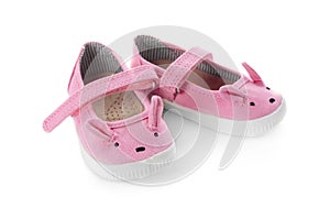 Cute pink child shoes isolated