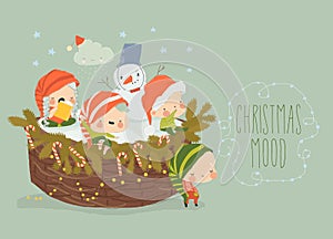 Cute Playful Christmas Elves sitting on Christmas Basket