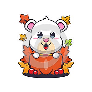 Cute polar bear in a pumpkin at autumn season.