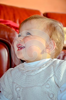 Cute portrait of a Caucasian baby girl with blue eyes