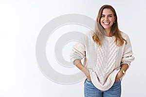 Cute positive enthusiastic charming caucasian woman casually standing white background good mood happy entertained
