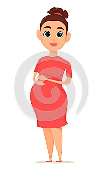 Cute pregnant woman in red dress. Pregnancy is the happiest time in life of every woman.