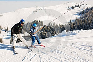 Cute preschool child, boy, skiing happily in Austrian Apls