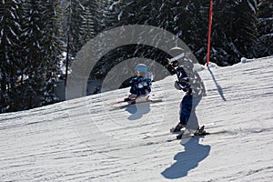 Cute preschool child, boy, skiing happily in Austrian Apls