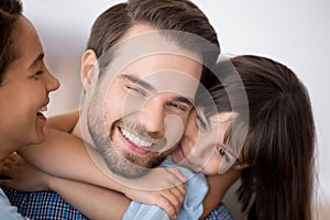 Cute preschooler daughter hug father showing love