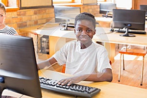 Cute pupil in computer class