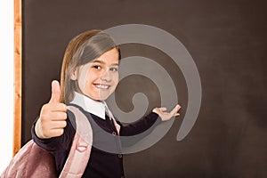 Cute pupil smiling at camera