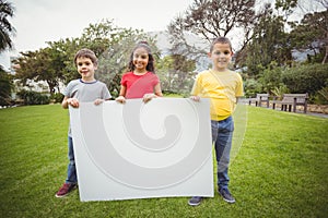 Cute pupils showing large poster