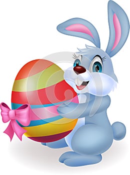 Cute rabbit cartoon holding easter egg
