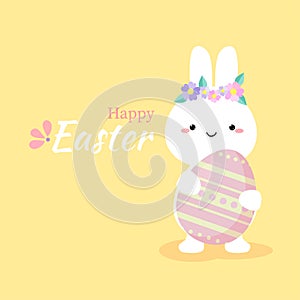 Cute rabbit holding colorful easter egg