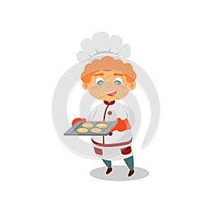 Cute red-haired boy holding tray with fresh-baked cookies. Future job. Kid in chef hat and uniform. Flat vector design