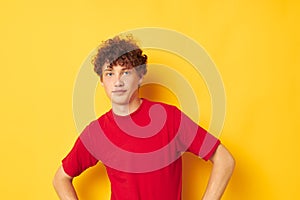 cute red-haired guy red t shirt fun posing casual wear  background unaltered