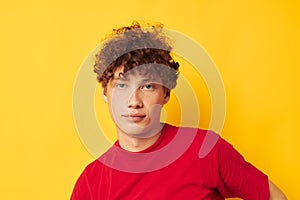 cute red-haired guy red t shirt fun posing casual wear isolated background unaltered