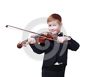 Cute redhead child boy plays violin isolated at white background