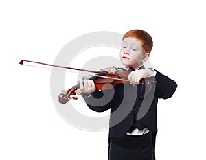 Cute redhead child boy plays violin isolated at white background