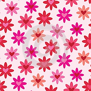 Cute retro flowers seamless pattern with hearts inside them in red, pink, fuchsia and coral on white background