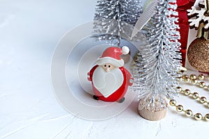 Cute Santa claus doll , Christmas tree and gift box on white background.
