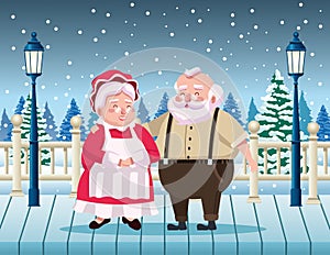 cute santa claus and wife in the snowscape scene