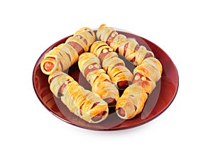 Cute sausage mummies isolated on white. Halloween party food