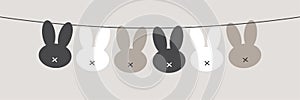 Cute Scandinavian Easter Bunny horizontal banner as bunting with primitive silhouettes of rabbit head in neutral colors