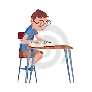 Cute Schoolboy Sitting at Desk and Reading Book, Boy Studying at Home Cartoon Vector Illustration