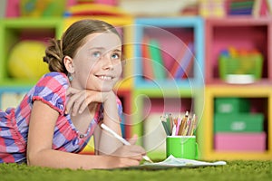 Cute schoolgirl doing homework