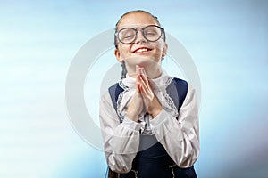 Cute Schoolgirl In Glasses Smile Implore Gesture photo