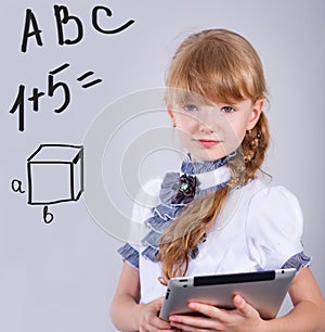 Cute schoolgirl with a laptop