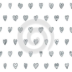 Cute seamless doodle pattern with different hearts.