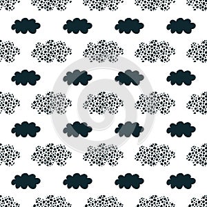 Cute seamless pattern with black clouds and hand drawn textures on a white background.