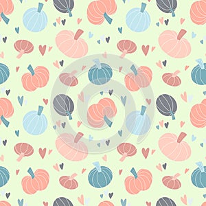 Cute seamless pattern with pastel pumpkins hand drawn in simple childish Scandinavian style and colorful hearts. Vector sweet