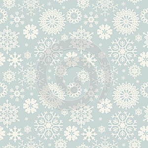 Cute seamless pattern with snowflakes on light blue bac