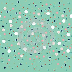 Cute seamless pattern or texture with colorful polka dots on green background. Used for kids background, blog, web design