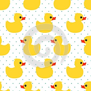 Cute seamless pattern with yellow rubber duck on polka dots background.