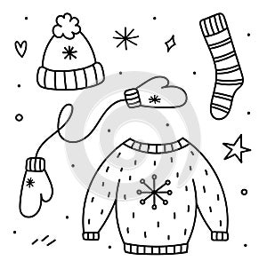 Cute set of winter clothes in doodle style