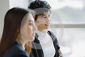 Cute and short hair businesswoman wearing eyesglasses in office