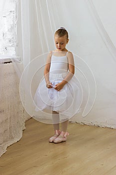 Cute shy little ballerina posing