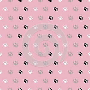 Cute simple seamless pattern with paw prints.