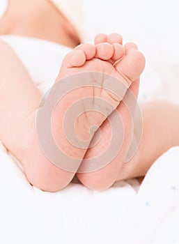 Cute small baby feet. Conceptual image of Maternity