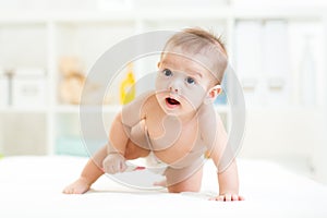 Cute small child boy weared in diaper photo