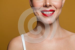 Cute smile with red lips and white teeth close up